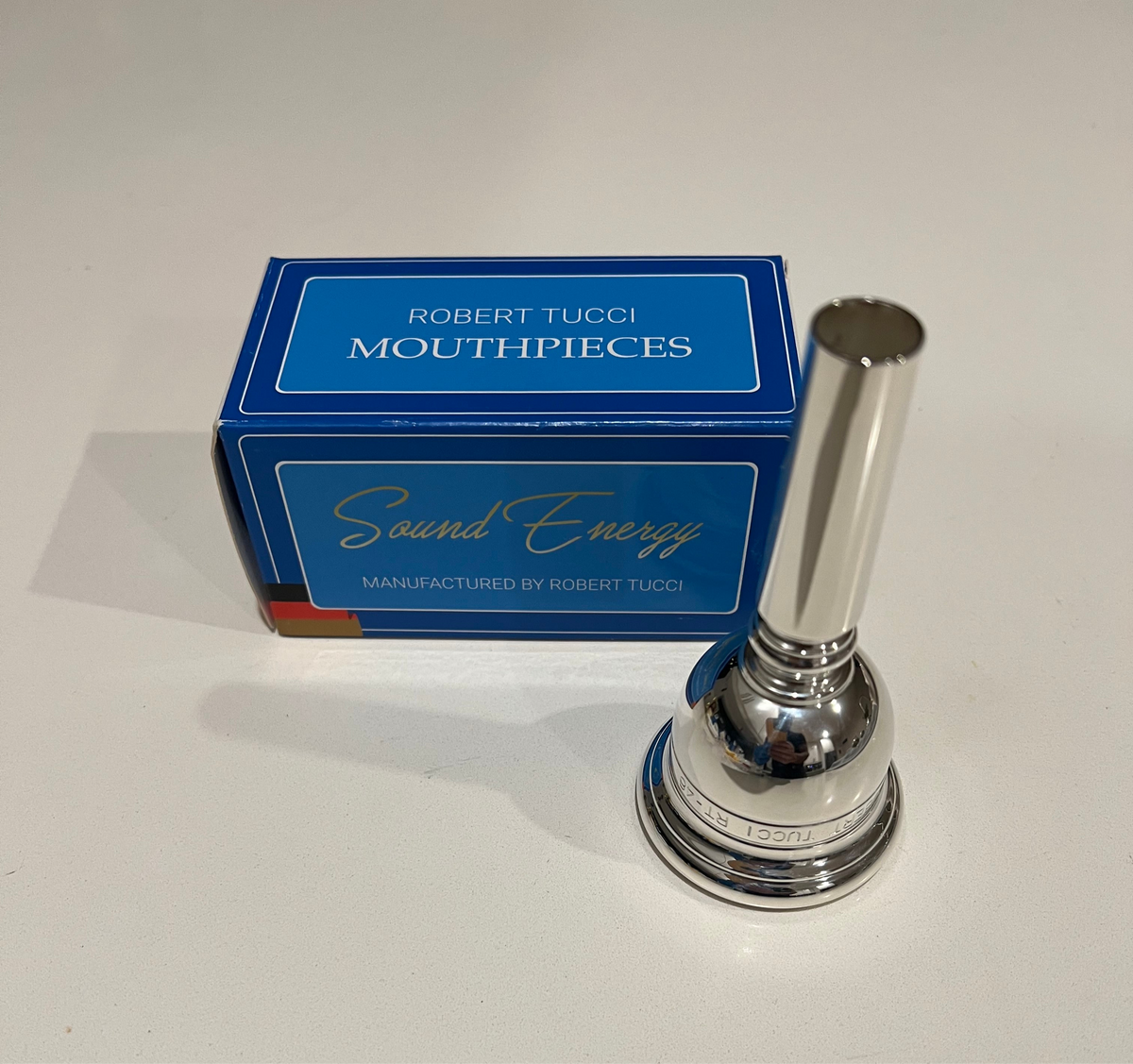 Silver Robert Tucci RT-48 Tuba Mouthpiece with blue Robert Tucci box.